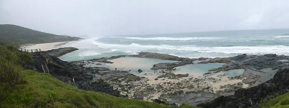 The champagne pools on K'gari island on a rainy day.