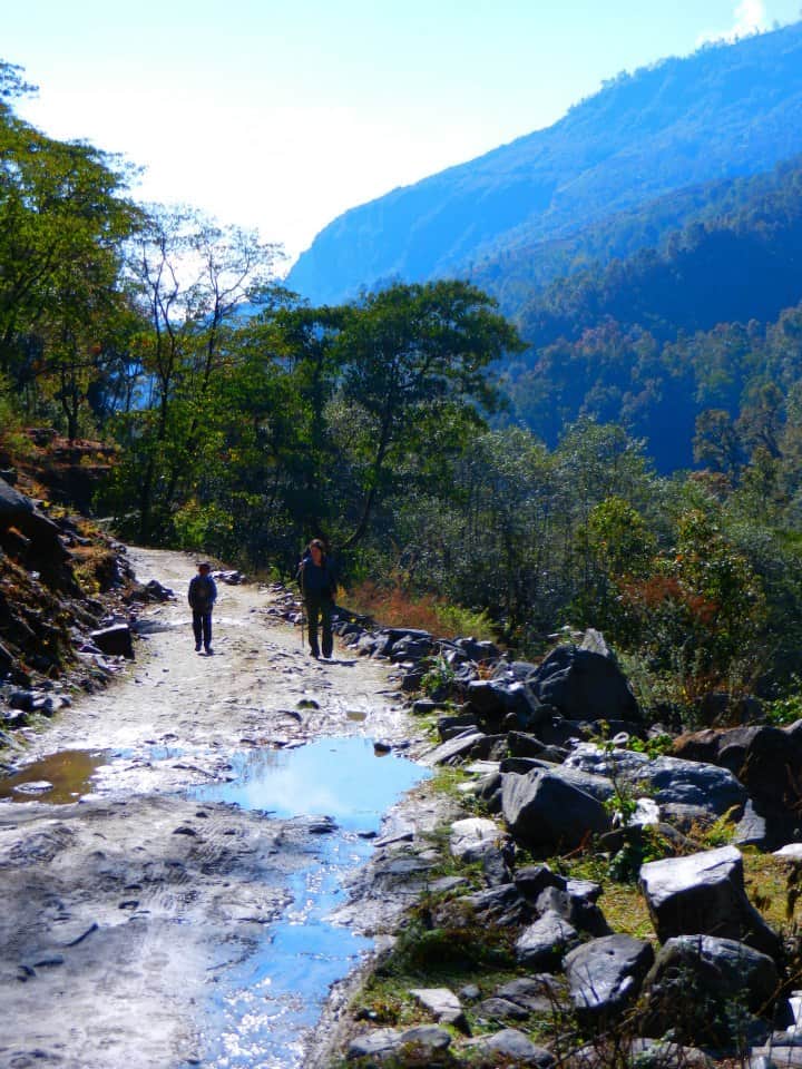 Trekking the Annapurna circuit with a young Nepalese boy.