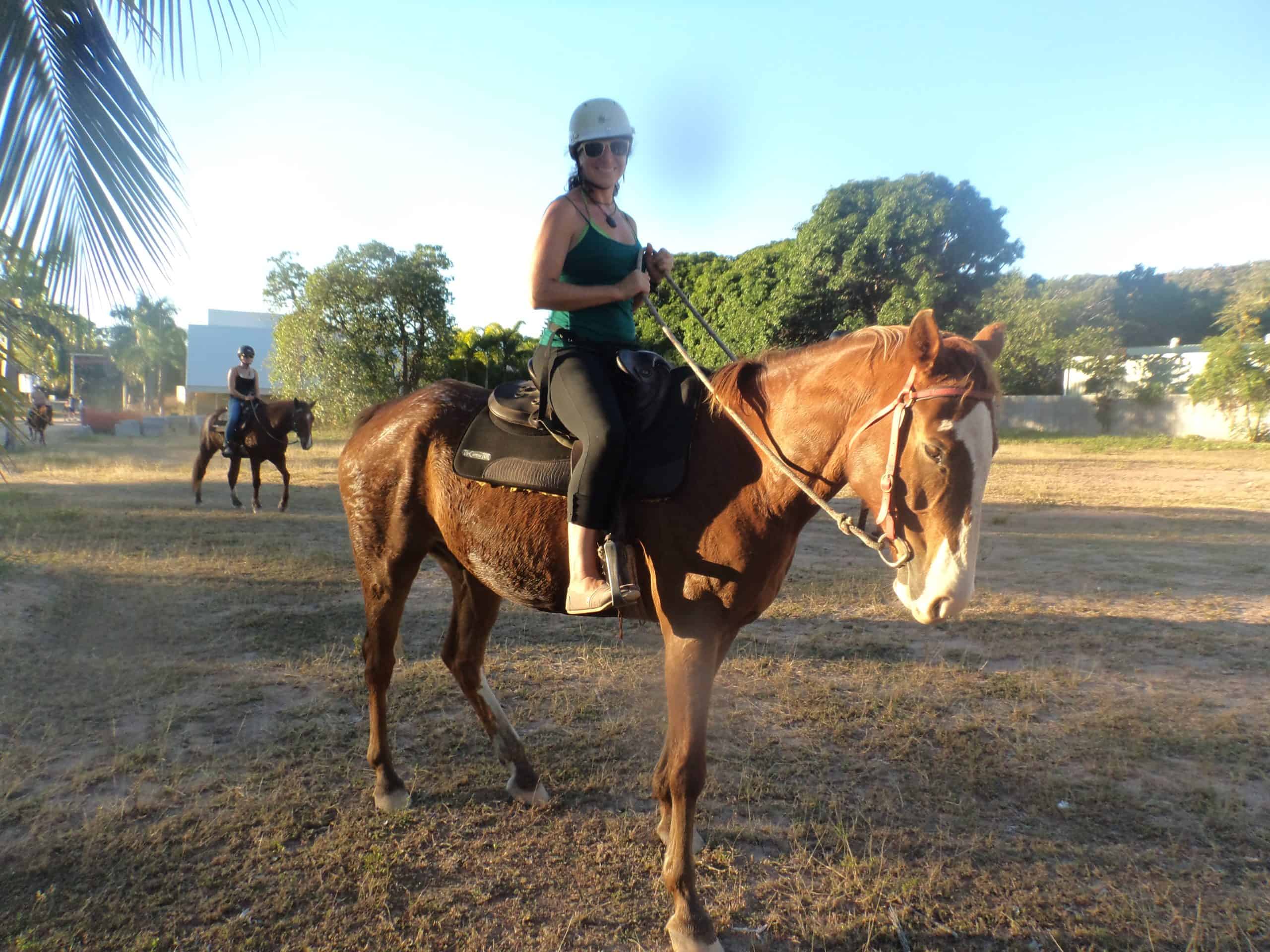 A woman on a horseback riding tour on Magnetic Island.