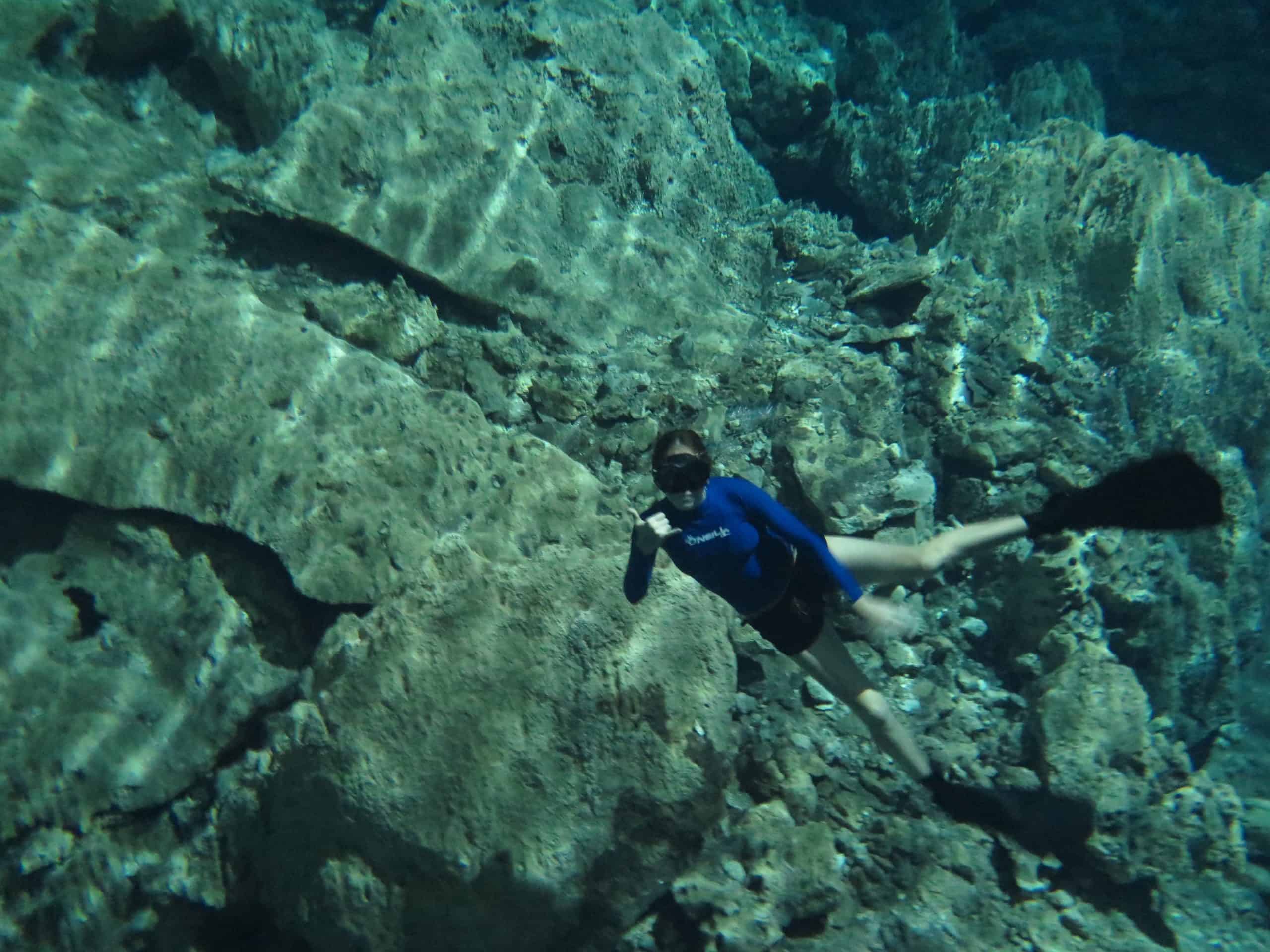 A swimmer freedives in a cenote in Tulum, Mexico.