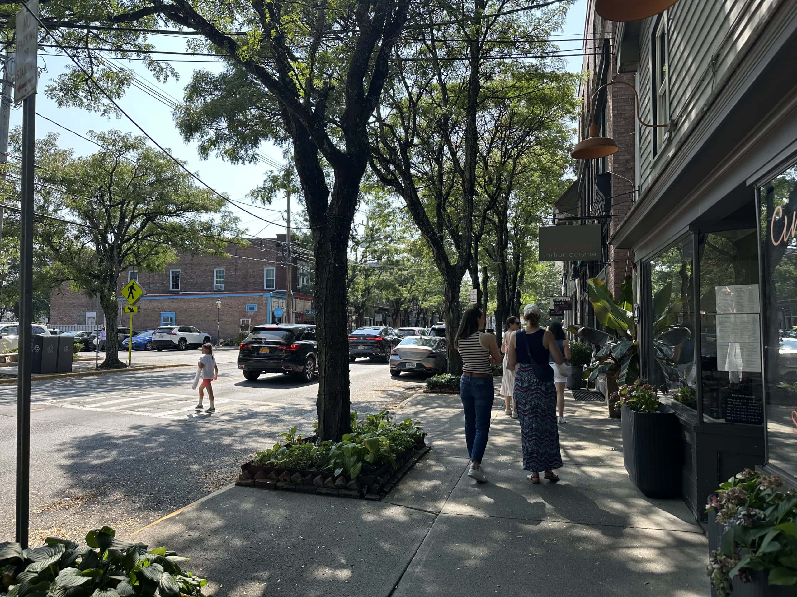Two women walk and window shop through the town of Rhinebeck, NY.