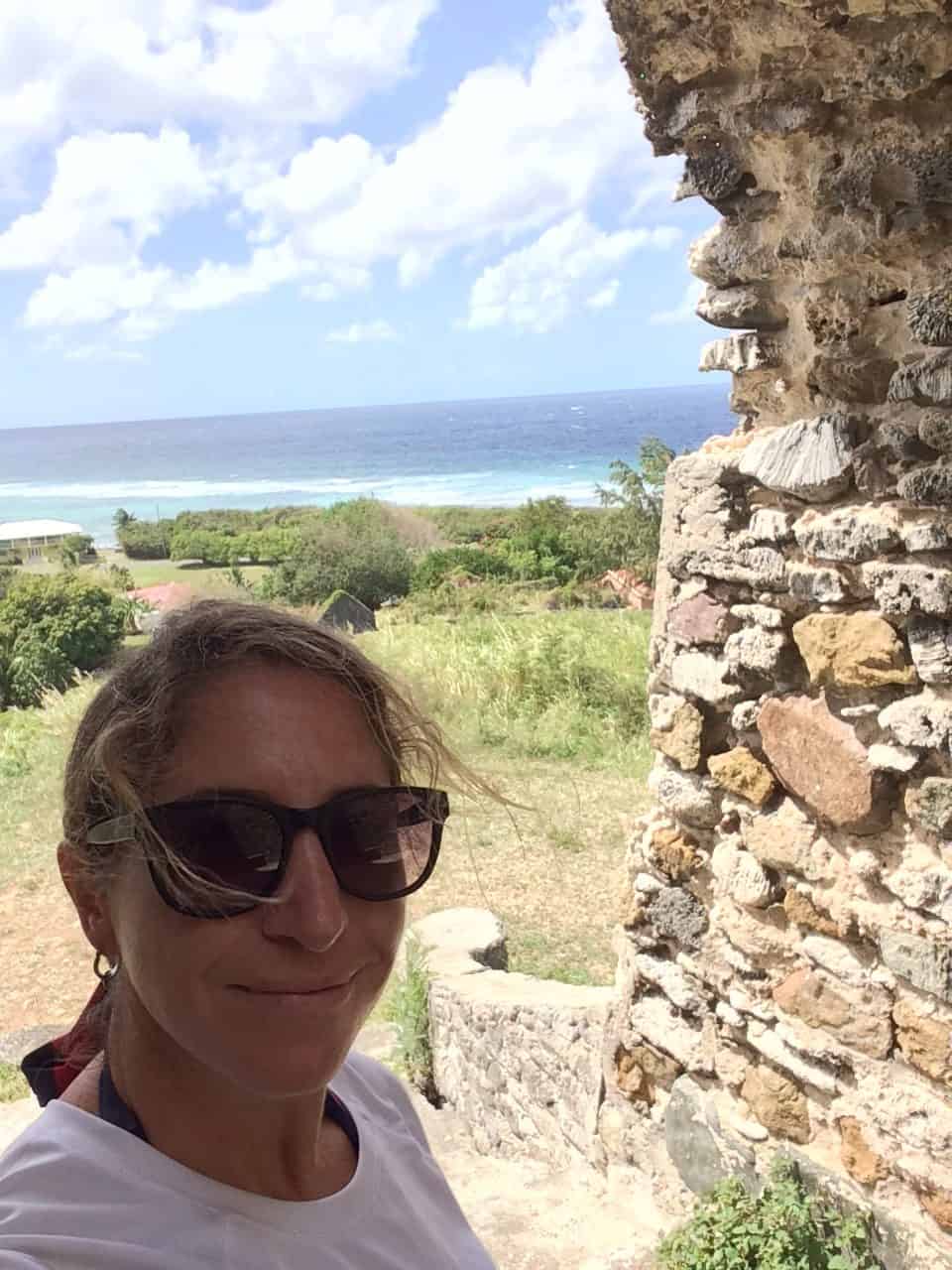 Blogger exploring sugar mill ruins on St. Croix in the Eastern Caribbean.