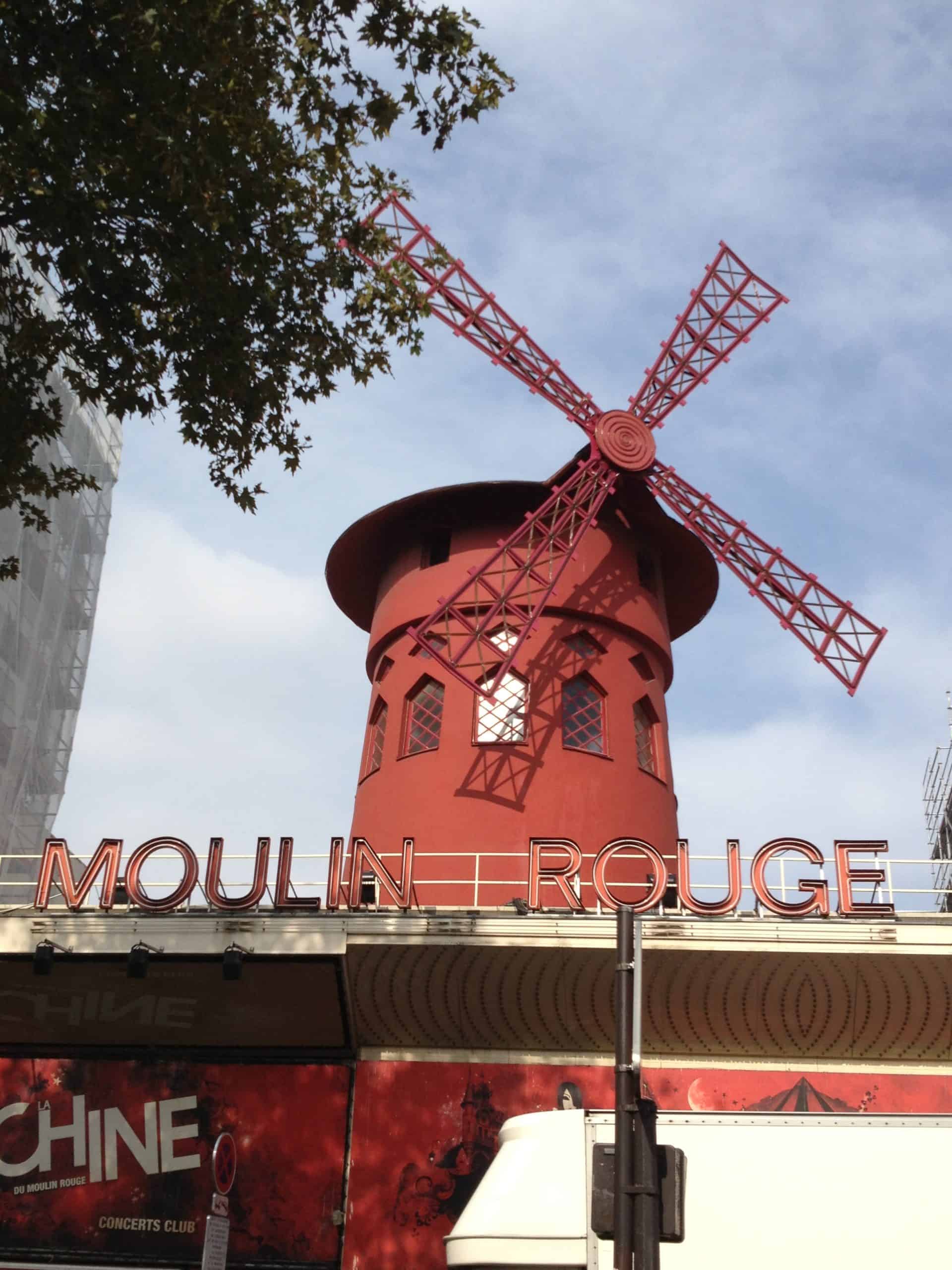 The iconic red windmill from the Moulin Rouge in Paris, France.