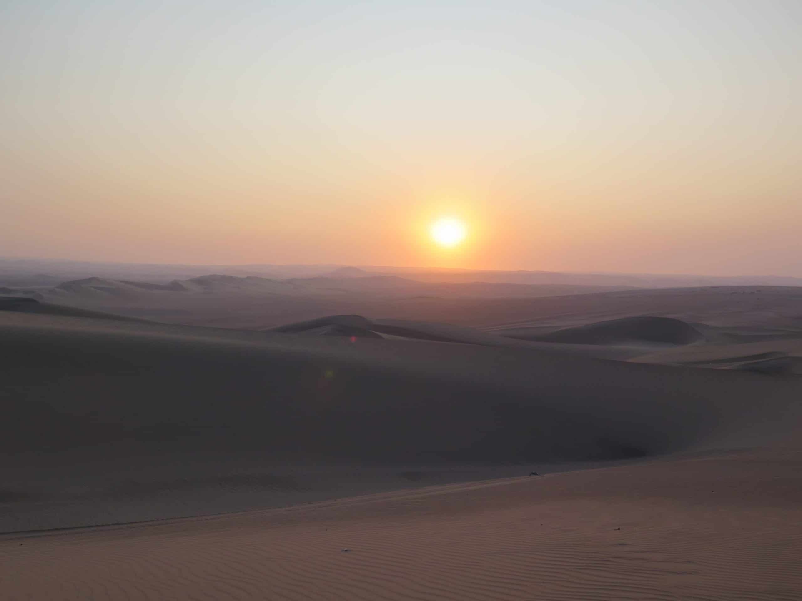 A stunning sunset in the desert in Peru.