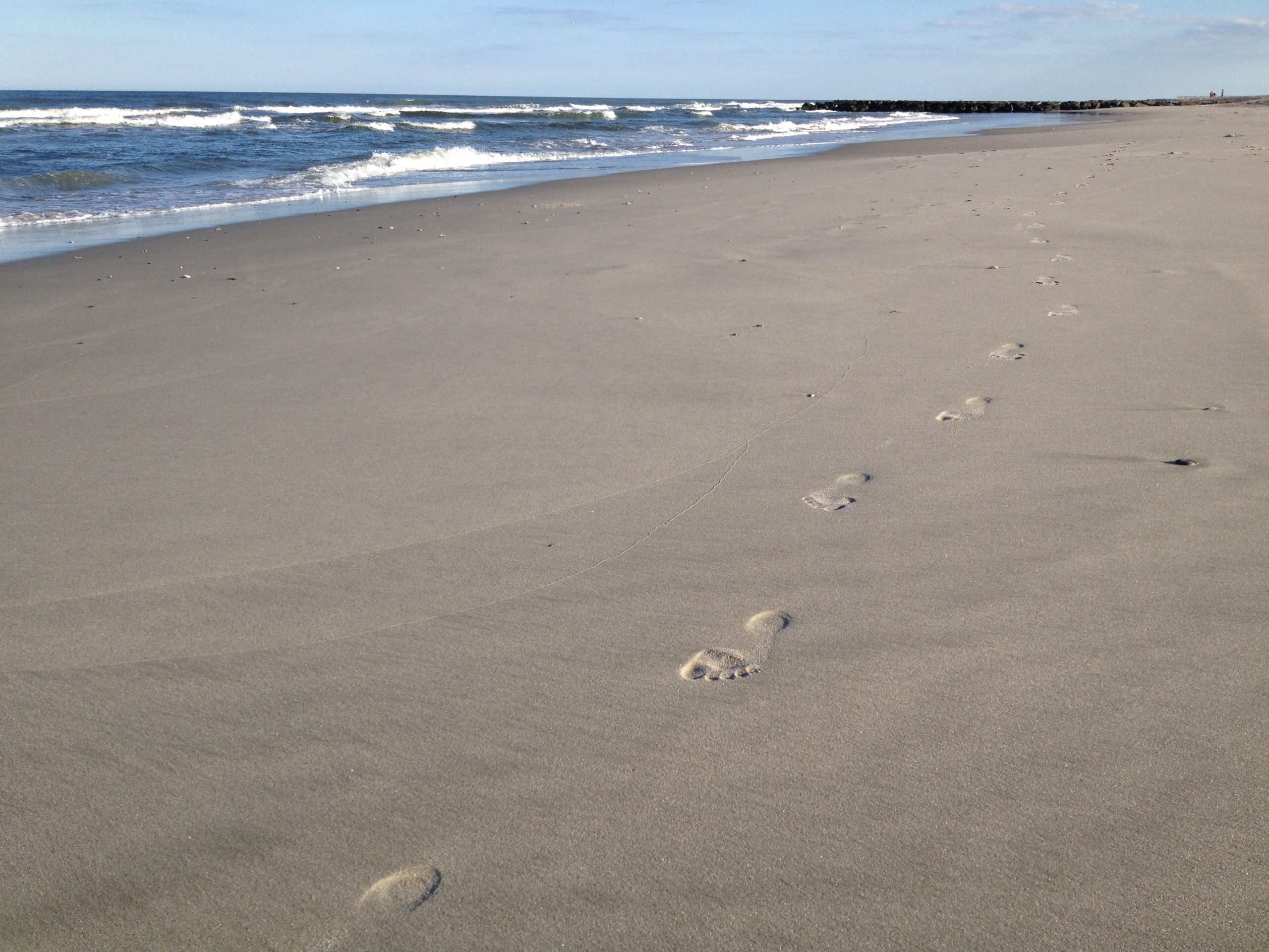 Footprints in the sand at the Ocean City, NJ beach.
