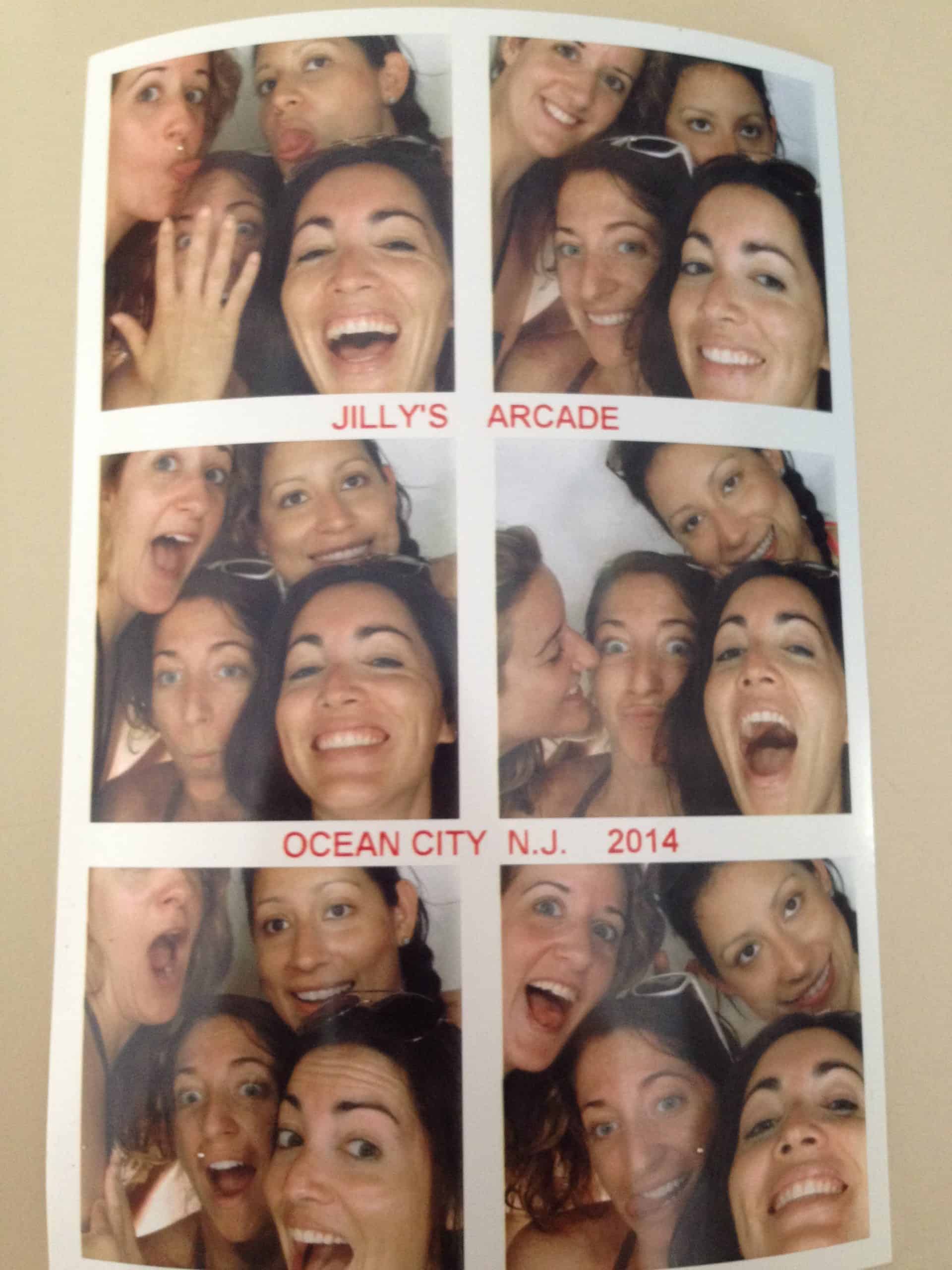 Group of girlfriends on a weekend trip to Ocean City, NJ take photos at the arcade.