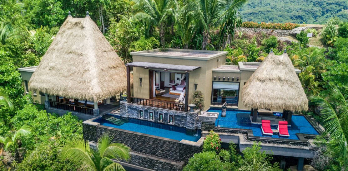 A luxury villa surrounded by lush jungle at the Anantara Maia Seychelles Villas resort.