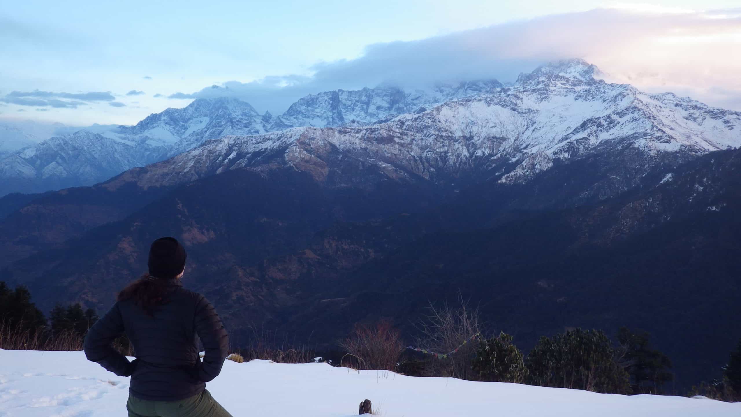 Trekker appreciates the beauty of the Annapurna mountains from Poon Hill.