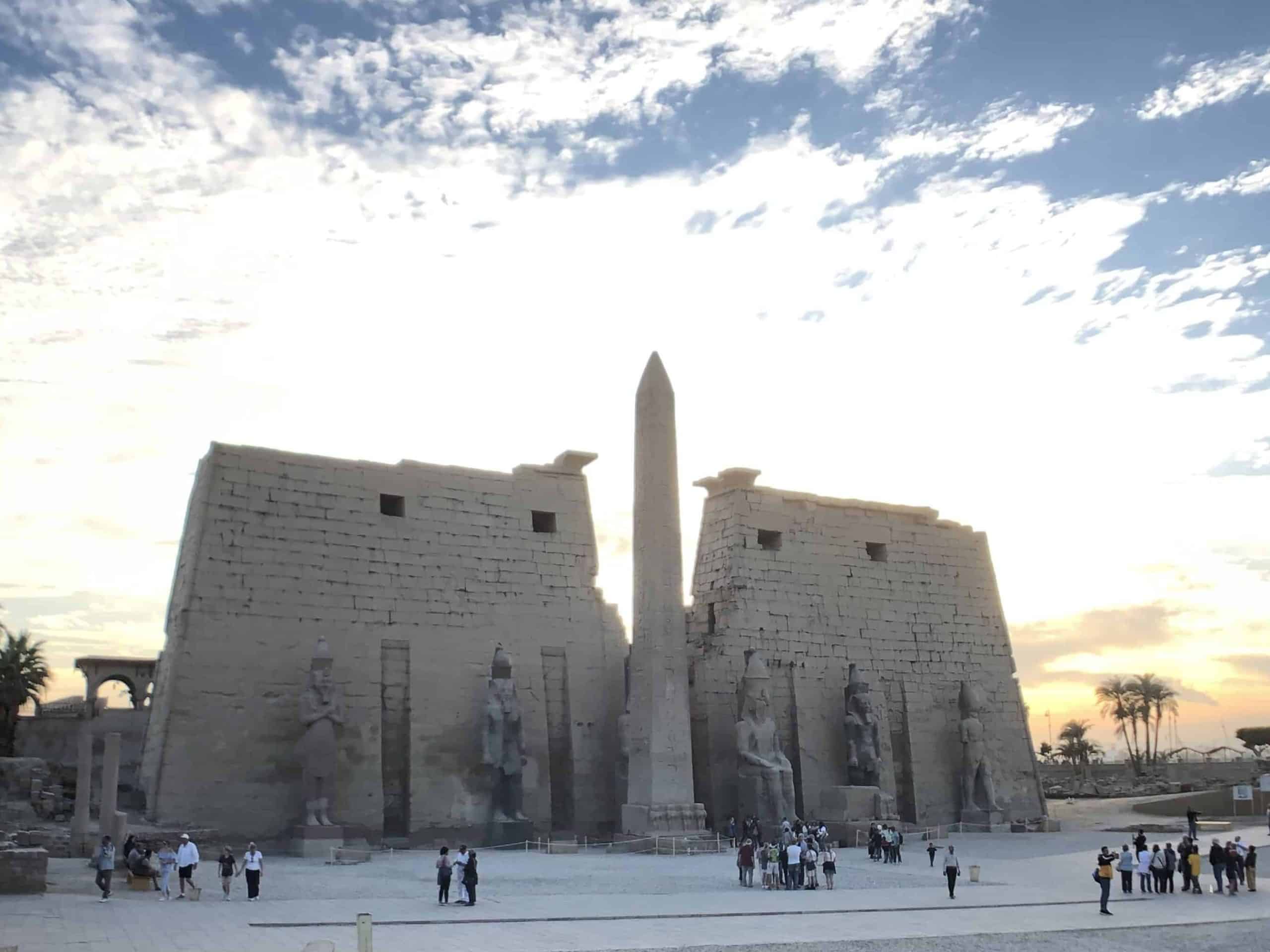 Obelisk and towering stone gates of Luxor Temple in Egypt.