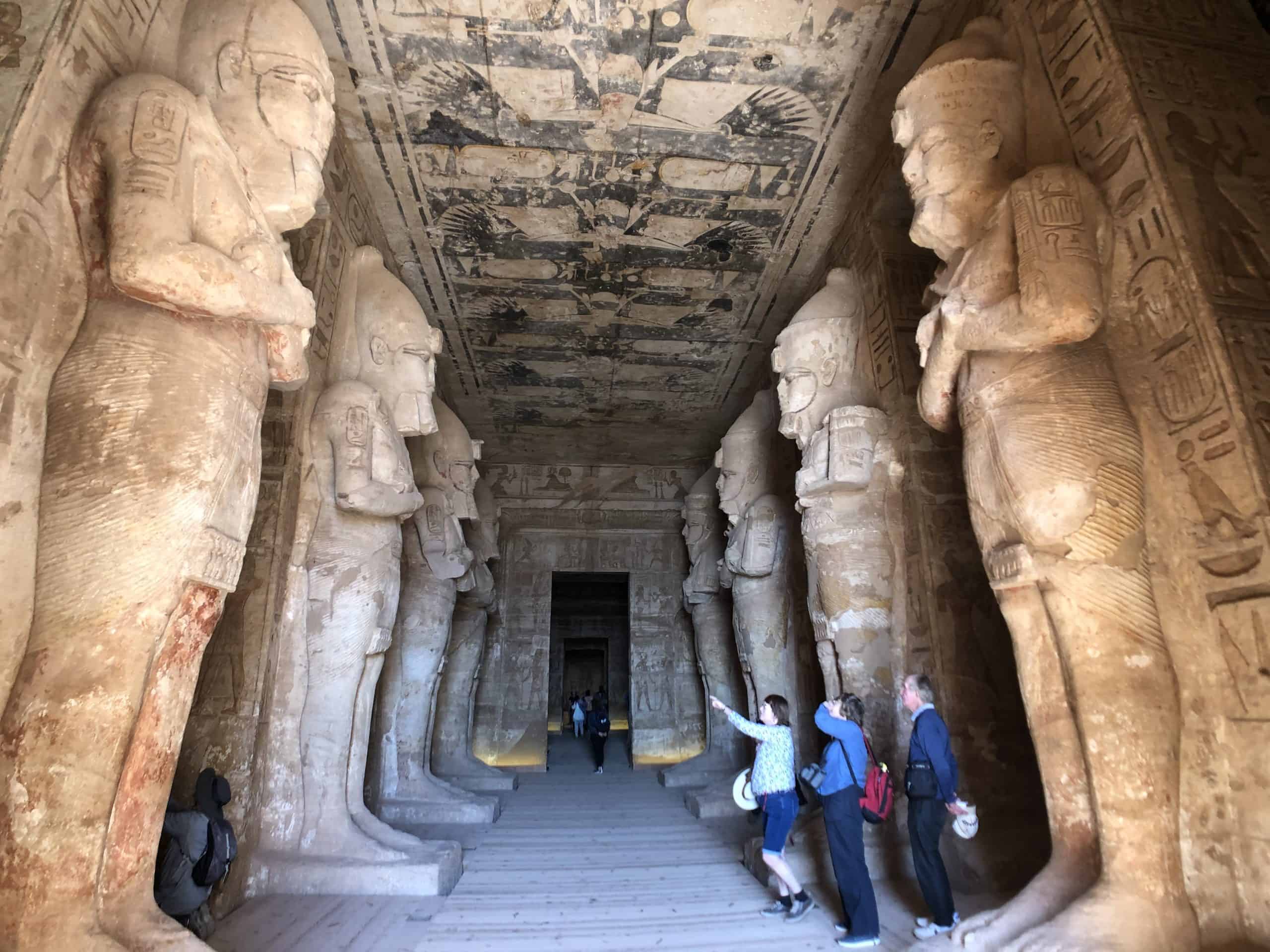 Large statues line the walls inside of Ramses II mortuary temple in Abu Simbel, Egypt.