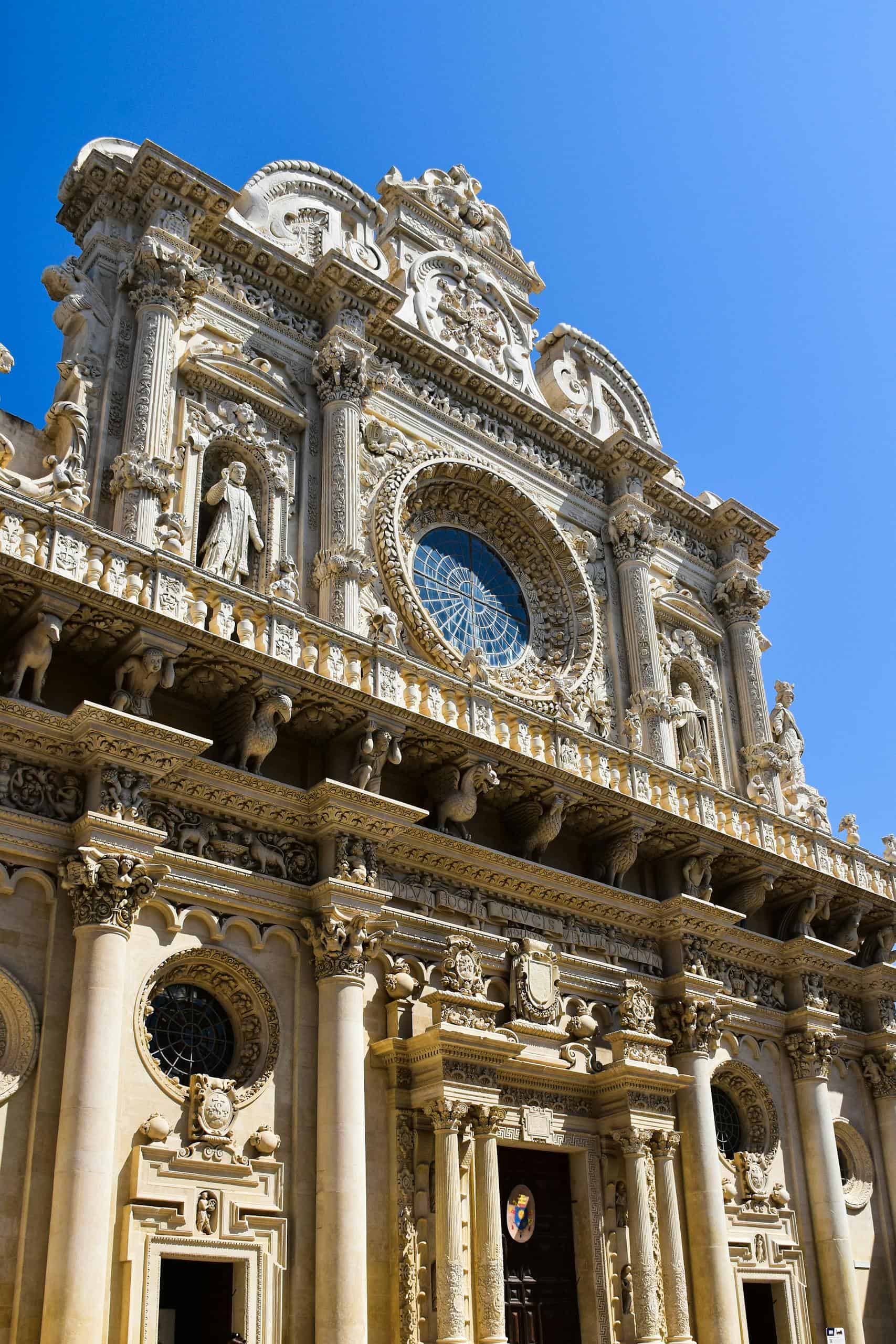 Stunning Baroque facade of Lecce Cathedral, showcasing intricate stonework in Apulia, Italy.