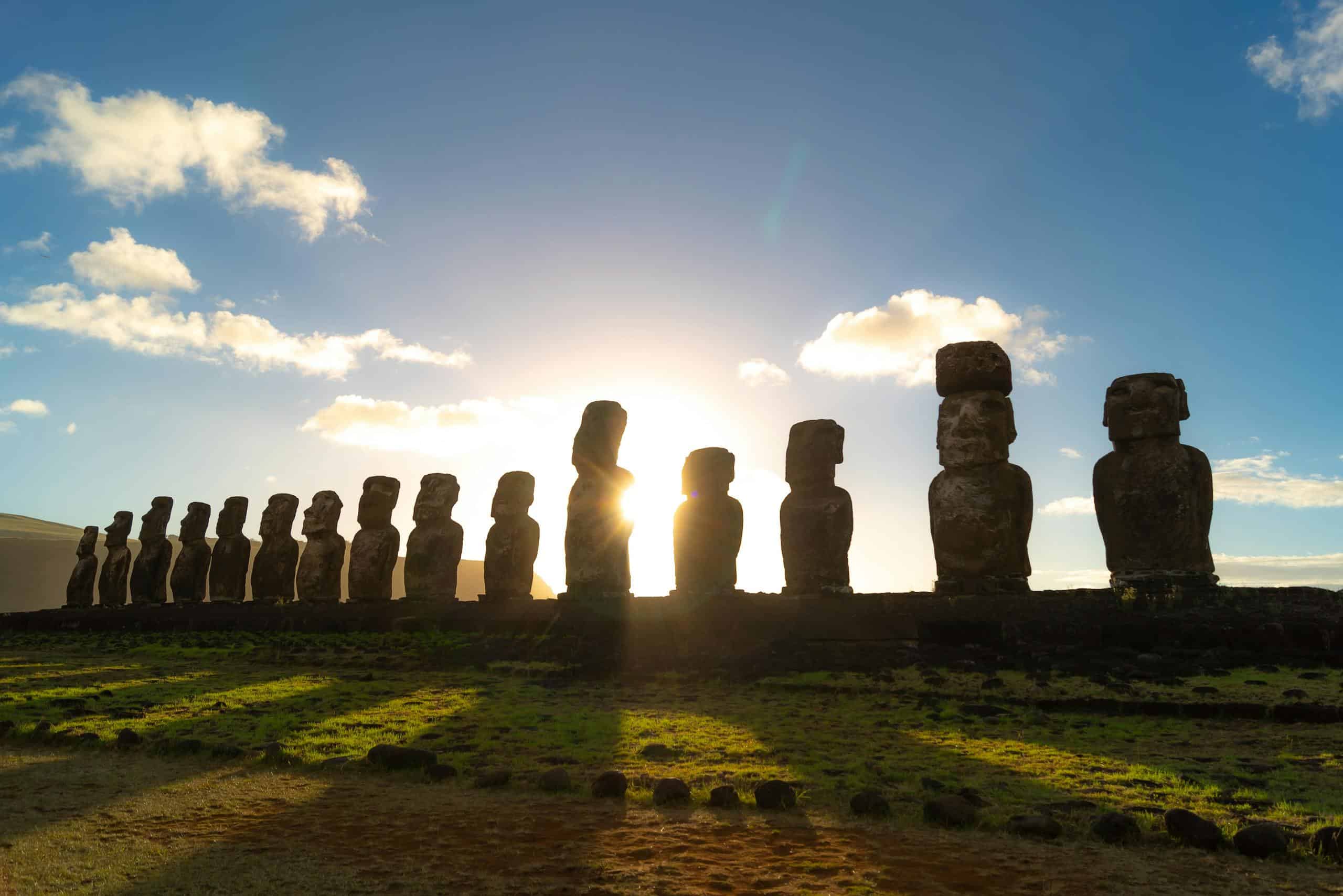 Stunning view of Moai statues on Easter Island at sunset, capturing their profound cultural significance.