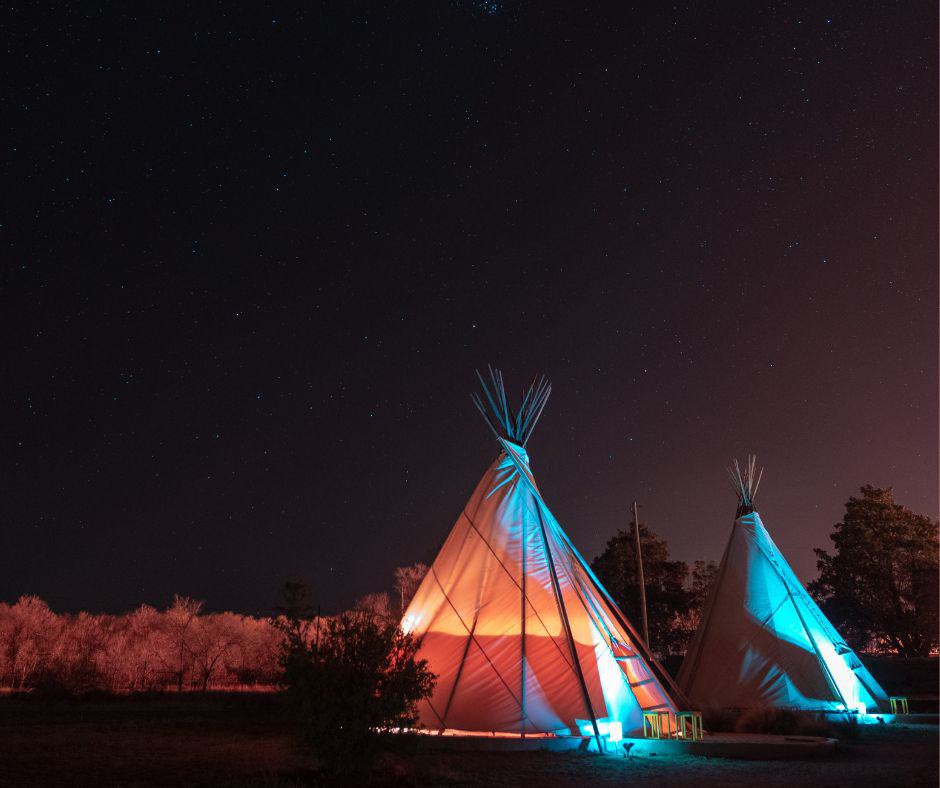 Teepee accommodations under a clear night sky in the desert of Marfa, Texas.
