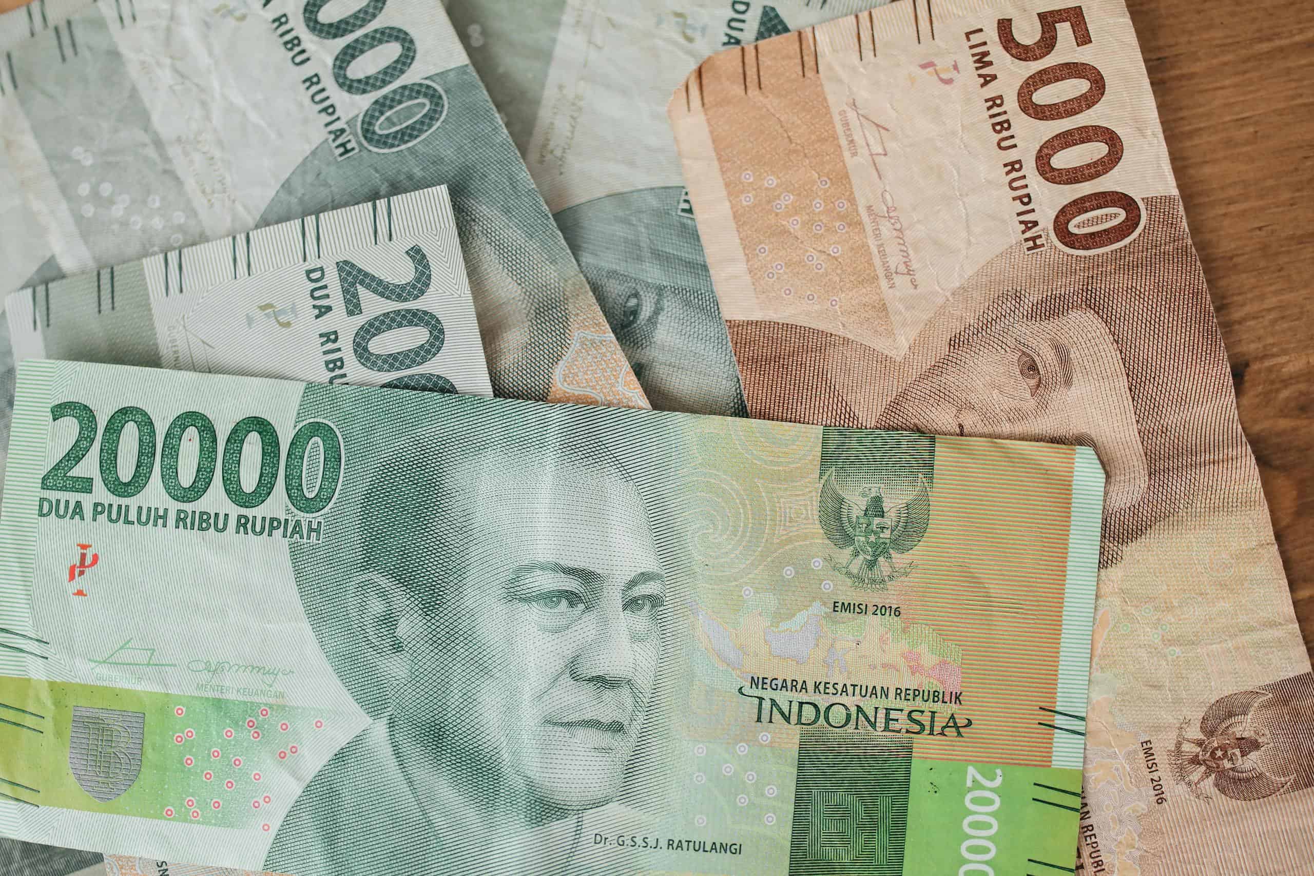 Close-up shot of various denominations of Indonesian Rupiah banknotes.
