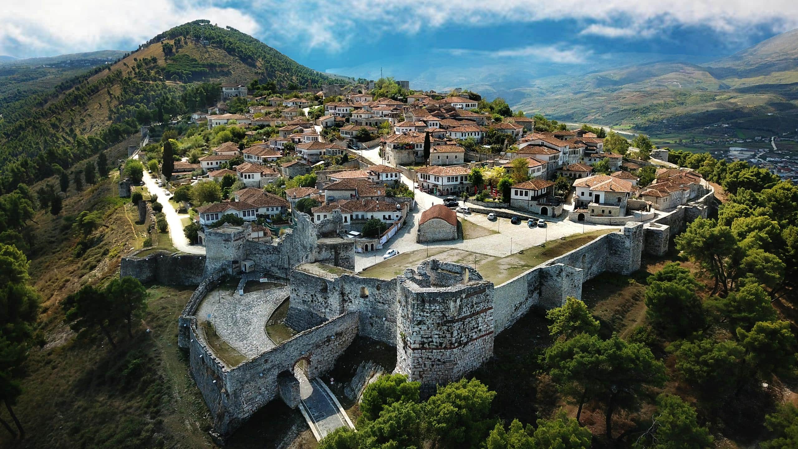 A breathtaking aerial shot of Berat Castle showcasing historic architecture and landscape.