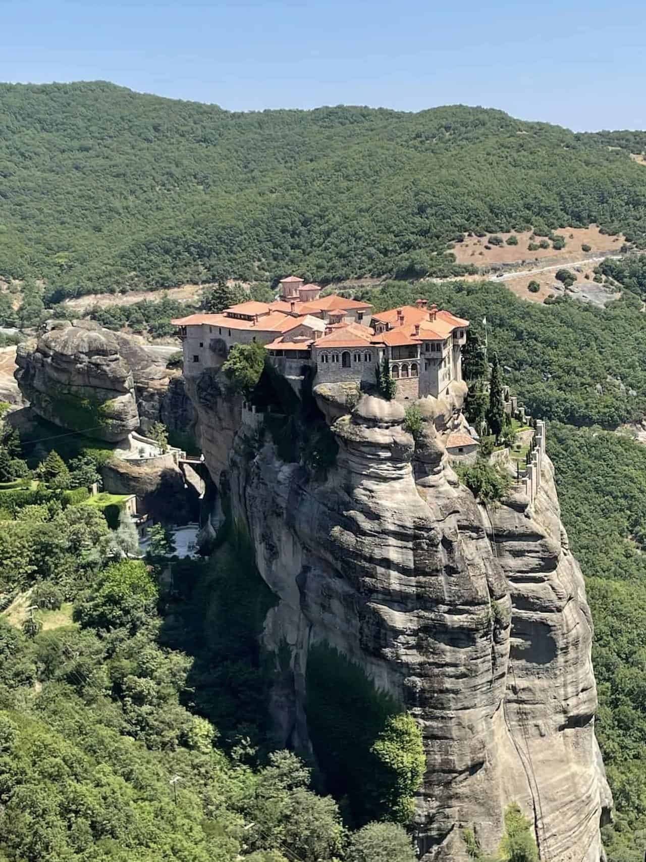 Breathtaking view of the Meteora Monastery perched atop dramatic rock formations in Greece.